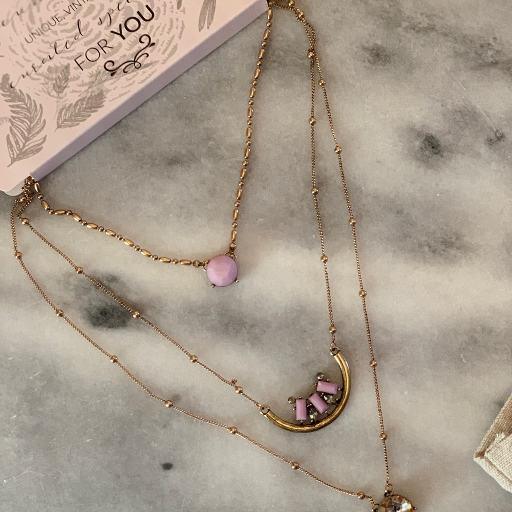 Gold necklace with purple/pink and diamond stones